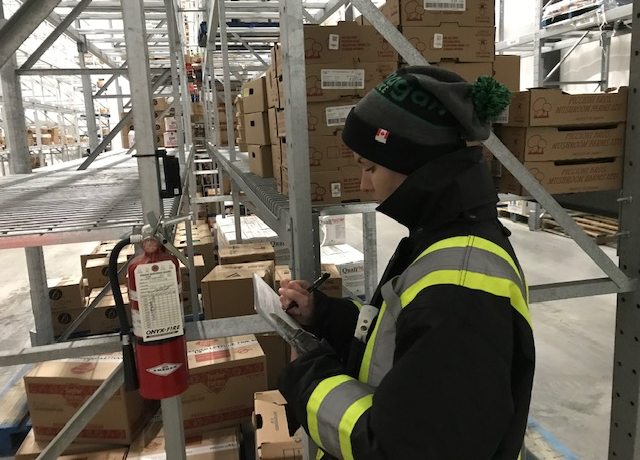 Woman checking safety standards at Flanagan Foodservice